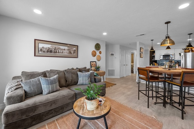 living room with light hardwood / wood-style floors