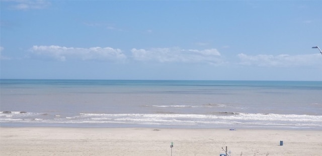 view of water feature with a beach view