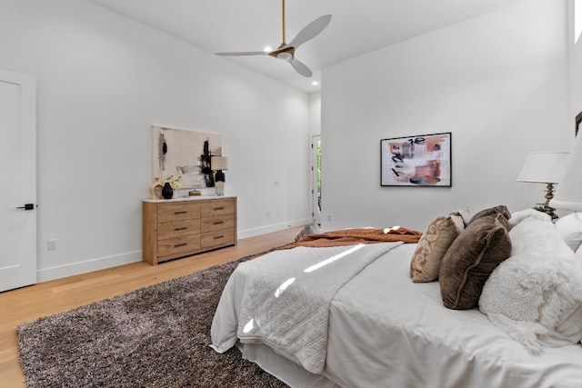 bedroom with hardwood / wood-style floors and ceiling fan