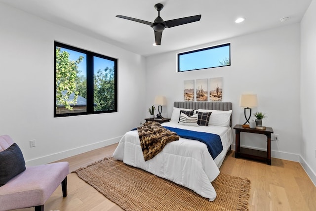 bedroom featuring ceiling fan and light hardwood / wood-style flooring