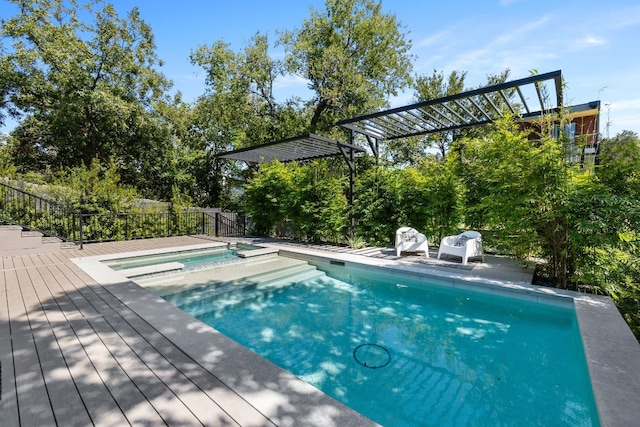 view of swimming pool with an in ground hot tub and a deck