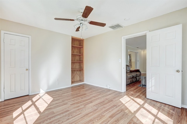 empty room featuring light hardwood / wood-style floors and ceiling fan