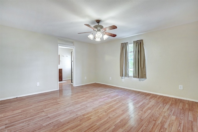 spare room featuring light hardwood / wood-style floors and ceiling fan