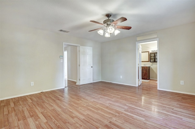 unfurnished room featuring light hardwood / wood-style flooring and ceiling fan