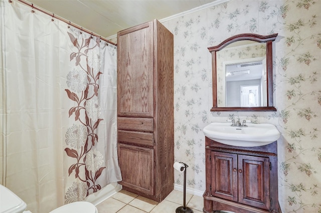 bathroom featuring toilet, ornamental molding, tile floors, and vanity