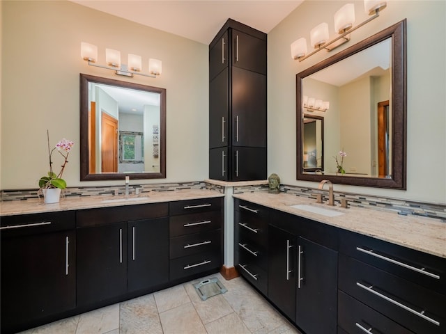 bathroom with tile flooring, tasteful backsplash, and vanity