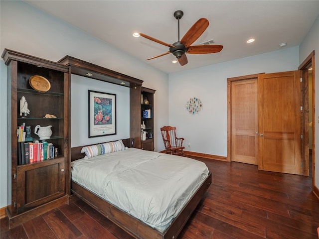 bedroom featuring dark hardwood / wood-style flooring and ceiling fan