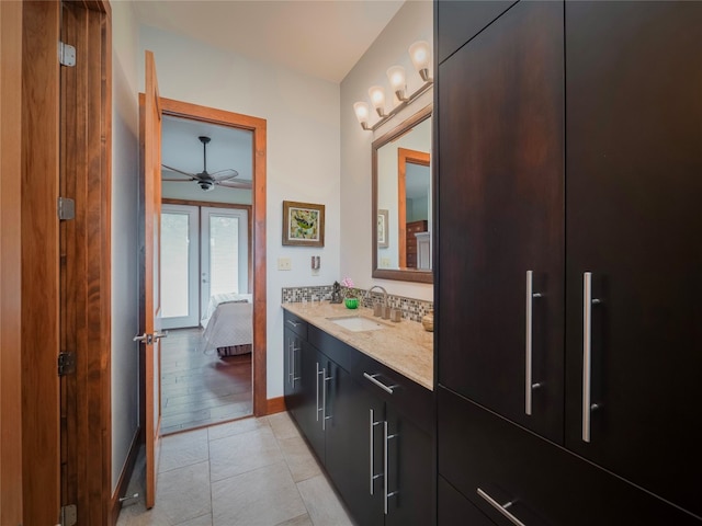 bathroom featuring ceiling fan, tile floors, large vanity, and french doors