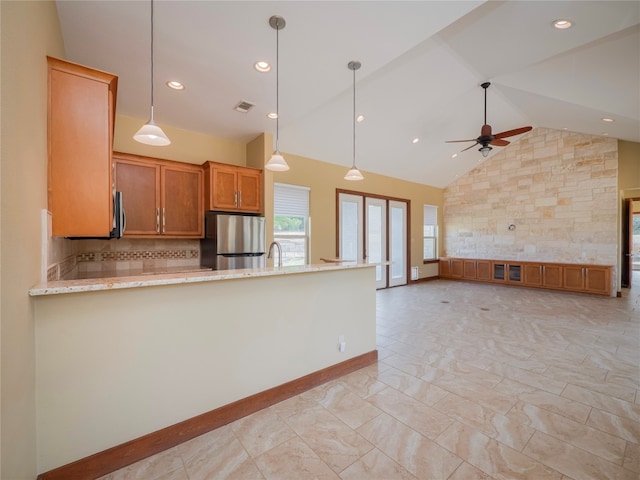 kitchen featuring backsplash, high vaulted ceiling, light tile floors, stainless steel fridge, and ceiling fan