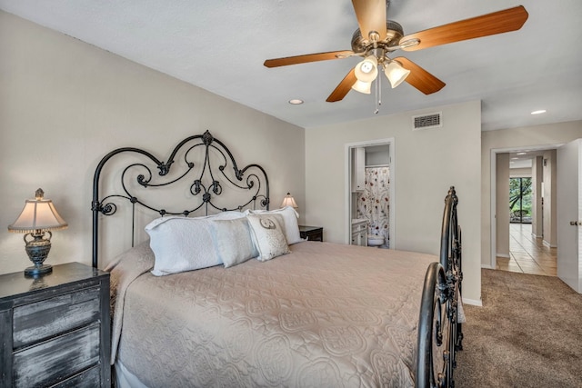 bedroom with ceiling fan and light colored carpet