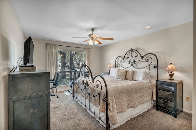 bedroom featuring light colored carpet and ceiling fan