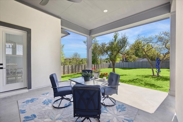 view of patio featuring outdoor dining space and a fenced backyard