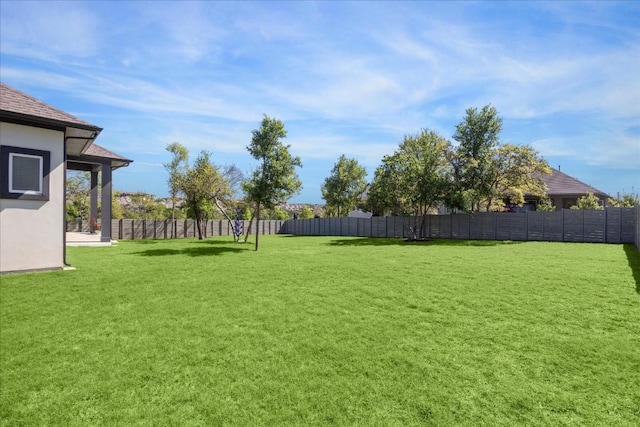 view of yard featuring fence