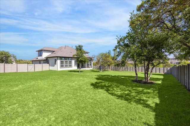 view of yard featuring a fenced backyard