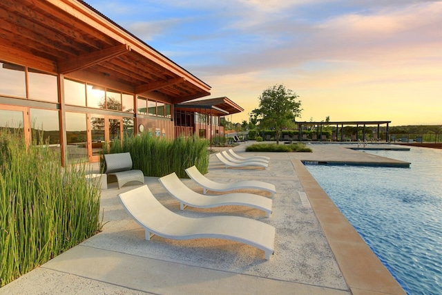 view of pool featuring a patio