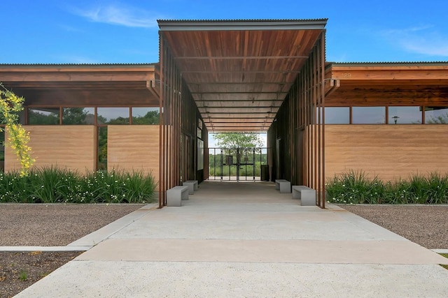 view of property's community with a carport and driveway