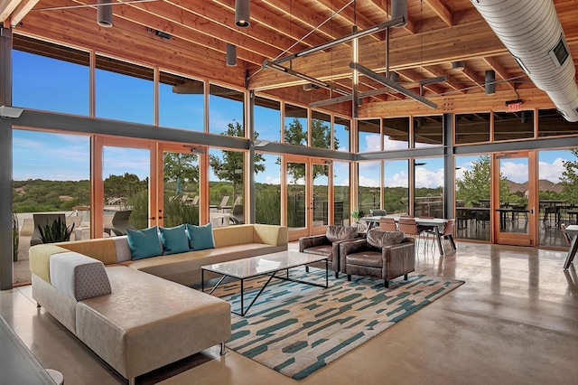 sunroom / solarium featuring french doors