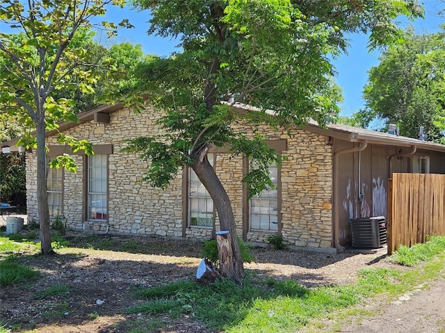 view of property exterior featuring central AC