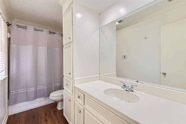 bathroom with ornamental molding, vanity, toilet, and wood-type flooring