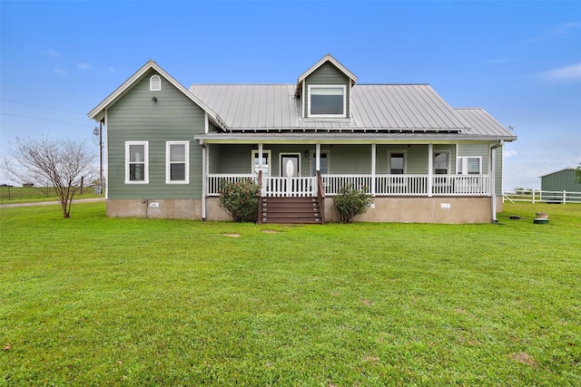 view of front facade with a front yard and covered porch