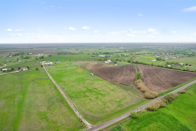 birds eye view of property with a rural view