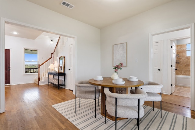 dining space with light wood-type flooring