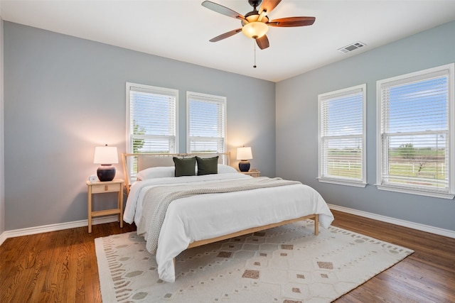 bedroom featuring ceiling fan and hardwood / wood-style flooring