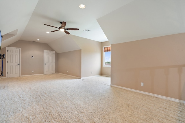 bonus room with lofted ceiling, ceiling fan, and light carpet