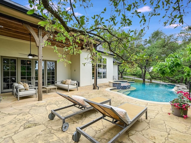 view of pool featuring a patio, an in ground hot tub, an outdoor hangout area, and ceiling fan