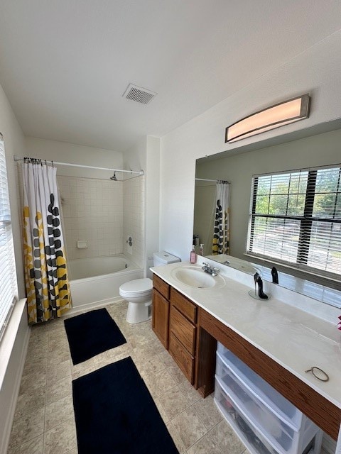 full bathroom featuring tile floors, shower / tub combo, toilet, and vanity