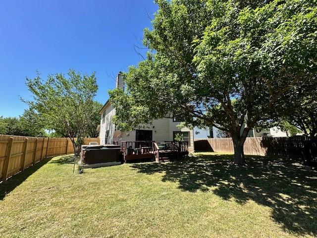 view of yard featuring a wooden deck