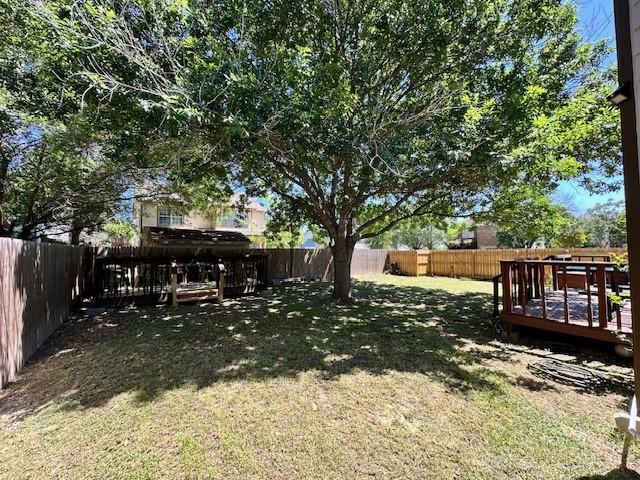 view of yard featuring a wooden deck