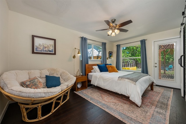 bedroom with access to outside, dark hardwood / wood-style floors, and ceiling fan