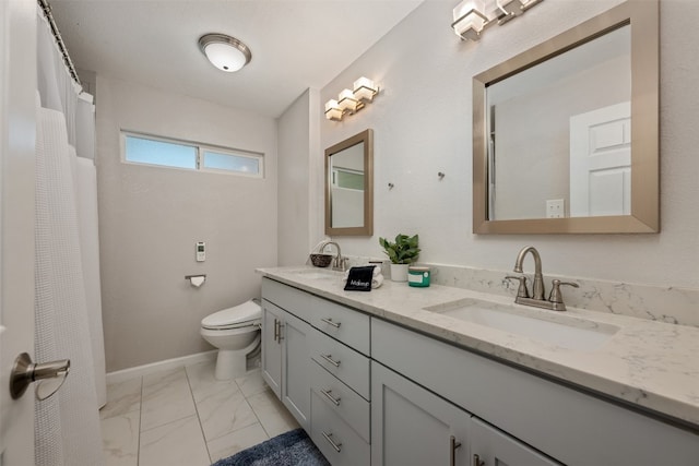 bathroom featuring toilet, tile floors, double sink, and vanity with extensive cabinet space