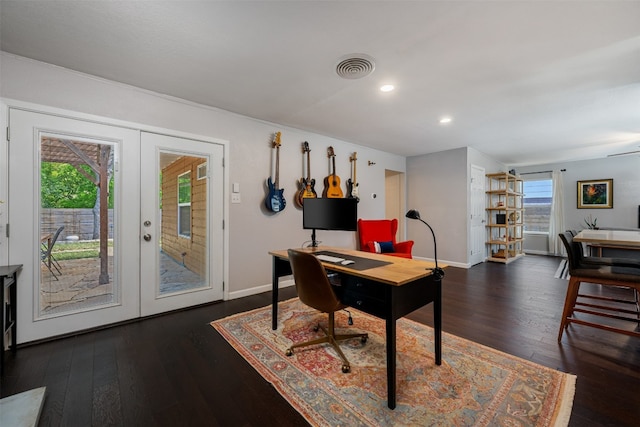 office with plenty of natural light, french doors, and dark hardwood / wood-style flooring