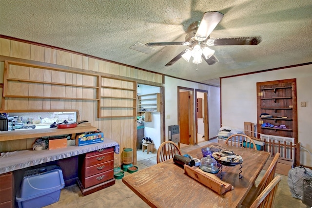 office space with ceiling fan, ornamental molding, and a textured ceiling