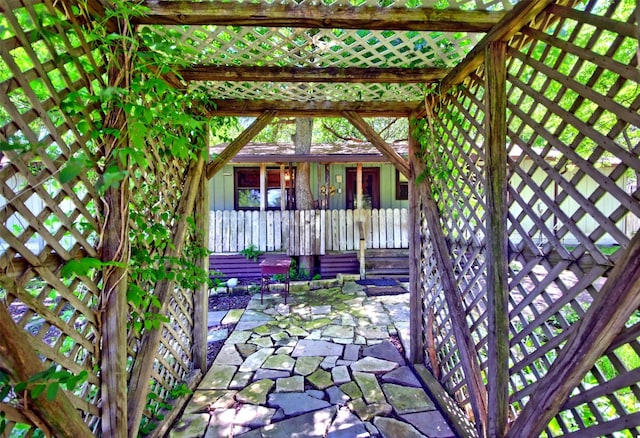 entrance to property featuring a patio