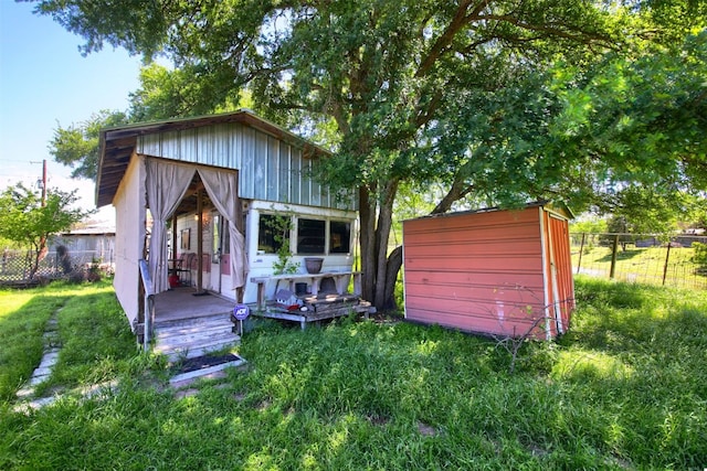 rear view of house with an outbuilding