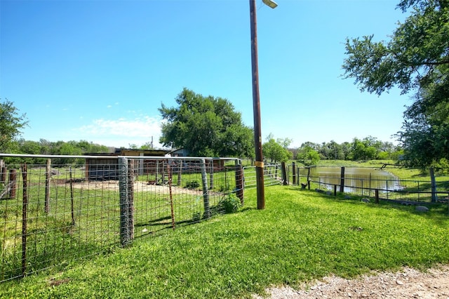 view of yard with a rural view