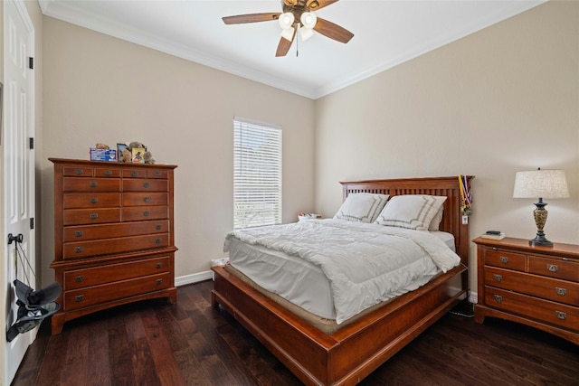 bedroom featuring ceiling fan, dark hardwood / wood-style floors, and crown molding