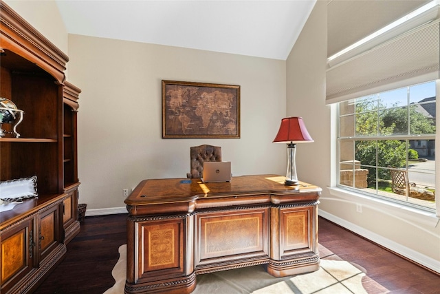 office with lofted ceiling, dark wood-type flooring, and a healthy amount of sunlight