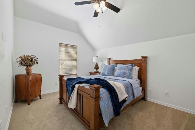 bedroom with ceiling fan, lofted ceiling, and light carpet