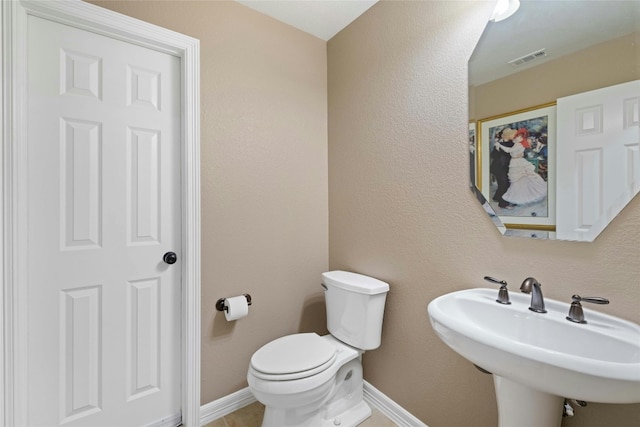 bathroom featuring sink and toilet