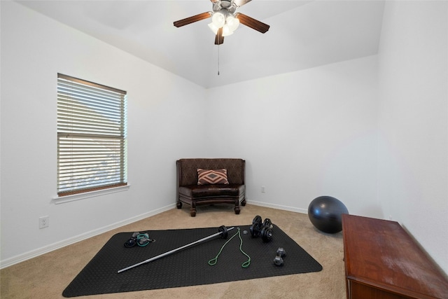 rec room with ceiling fan and light carpet