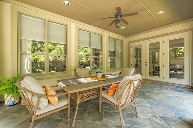 sunroom featuring ceiling fan and a healthy amount of sunlight