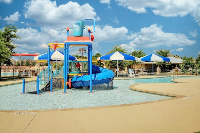 view of play area featuring a community pool