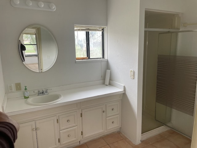 bathroom featuring tile flooring and vanity