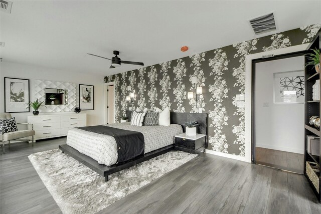 bedroom with ceiling fan and dark hardwood / wood-style floors