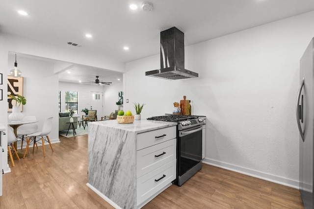 kitchen with ceiling fan, light hardwood / wood-style floors, stainless steel appliances, white cabinets, and island exhaust hood