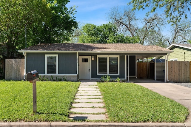 view of front of home with a porch, a carport, and a front yard